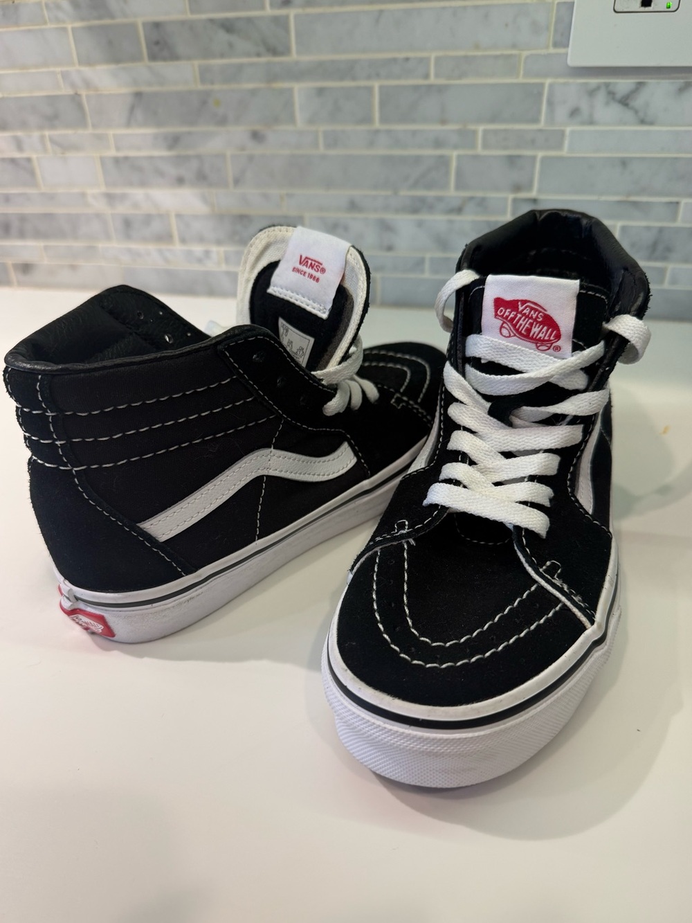 Vans Black and White Suede/Leather High-Top Sneakers with Red Logo